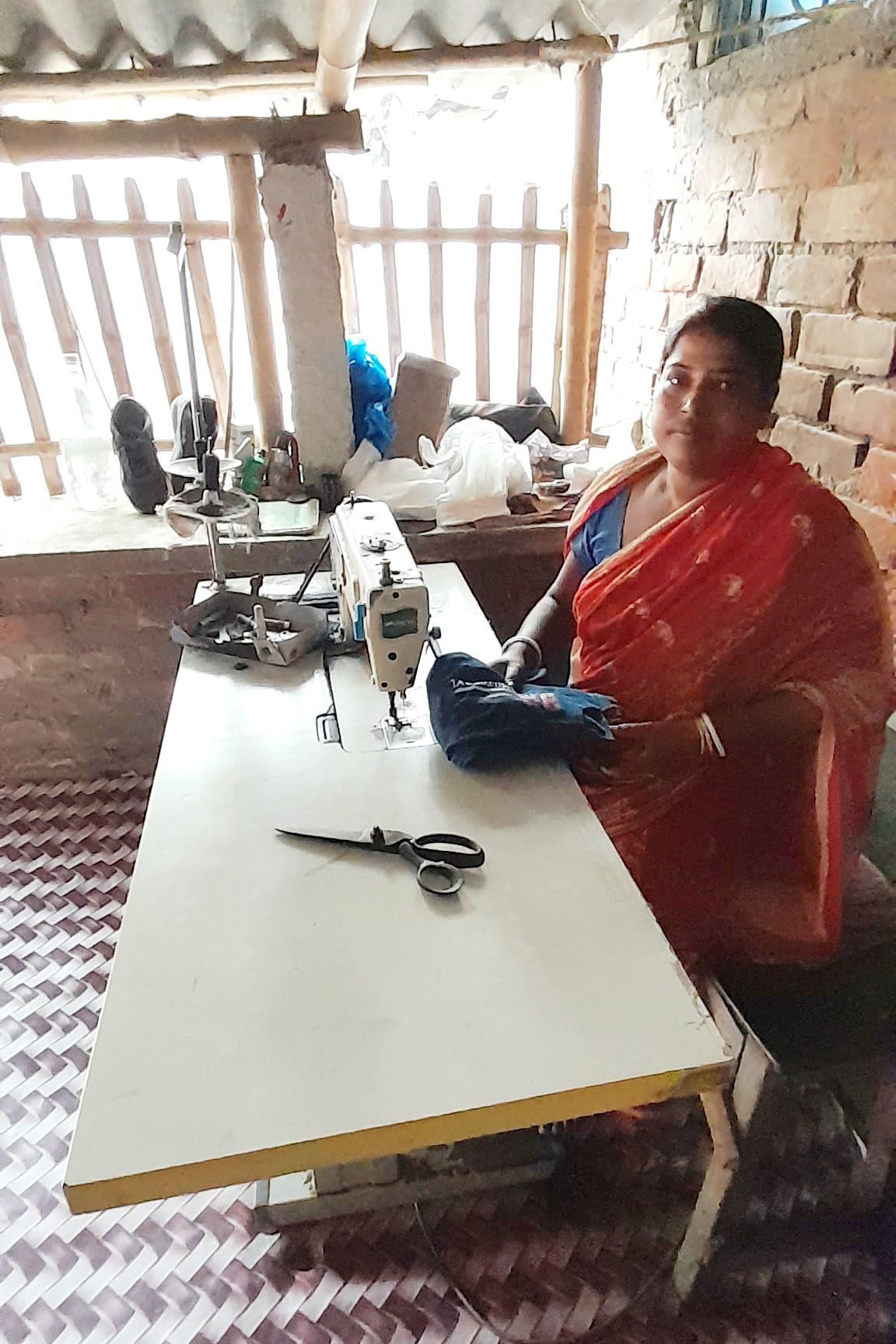 Uddipath Foundation borrower at her sewing machine