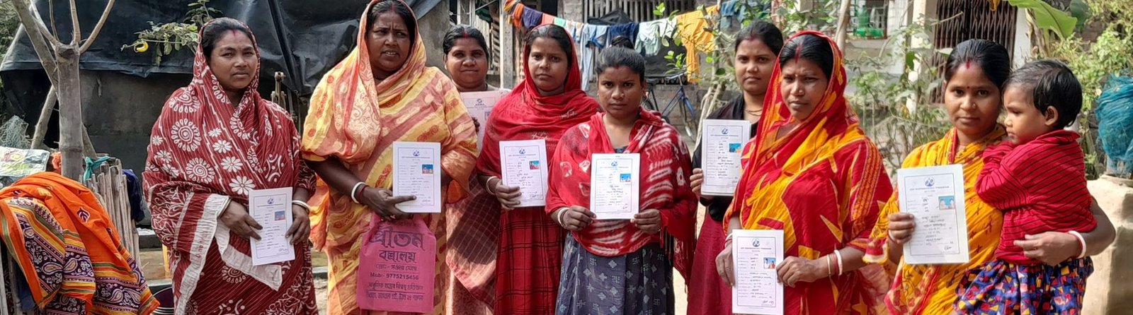 Women members of Uddipath Foundation&rsquo;s self-help groups holding their loan documents